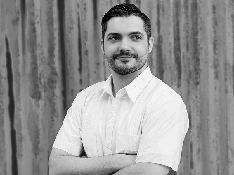 David Y. Soards looking arms crossed looking to his left